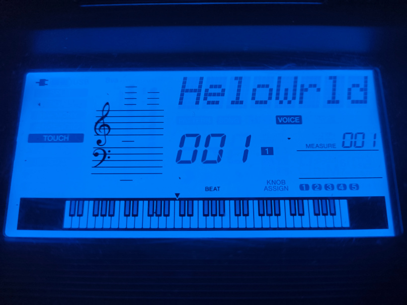 The LCD displaying “HeloWrld”